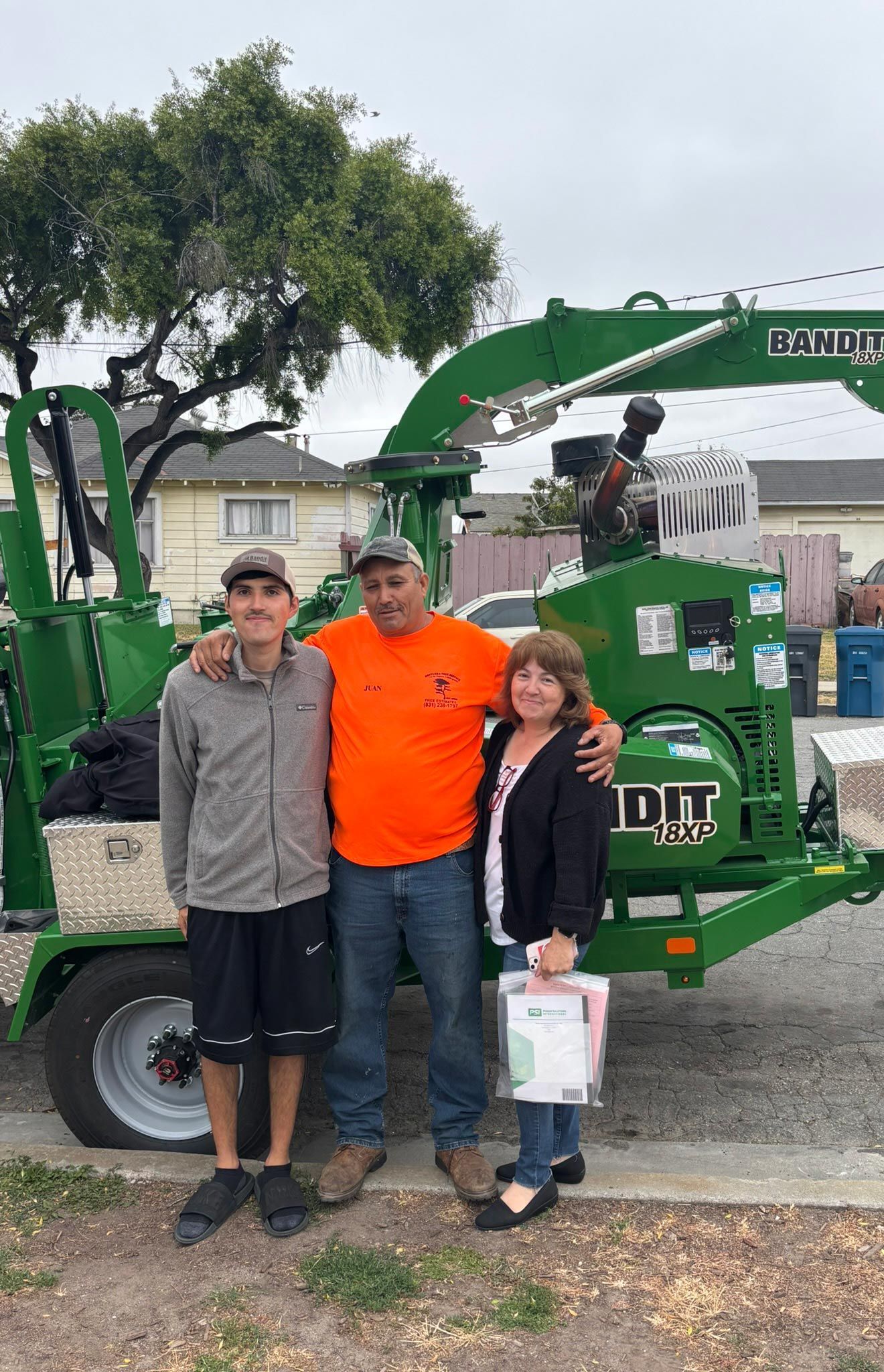 The Oseguera crew with their wood chipper